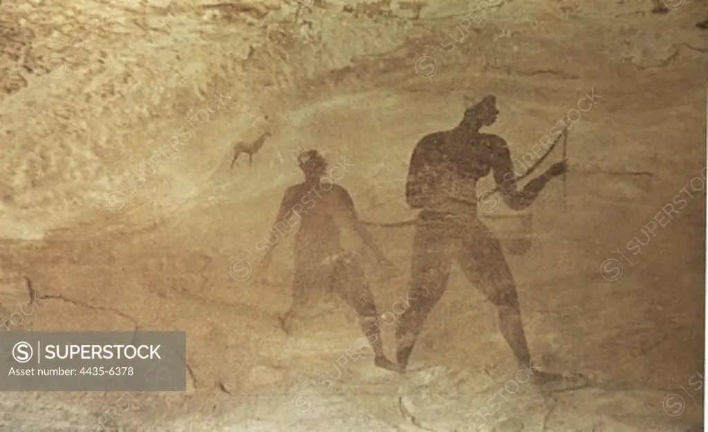 ALGERIA. Tassili N'Ajjer. Representation of hunters (c. 4000 BC). Neolithic art. Cave.