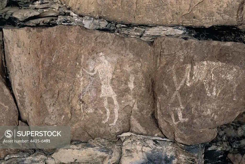 LIBYA. Tadrart Acacus. Representation of shepherds (12.000-8000 BC). Neolithic art. Cave.