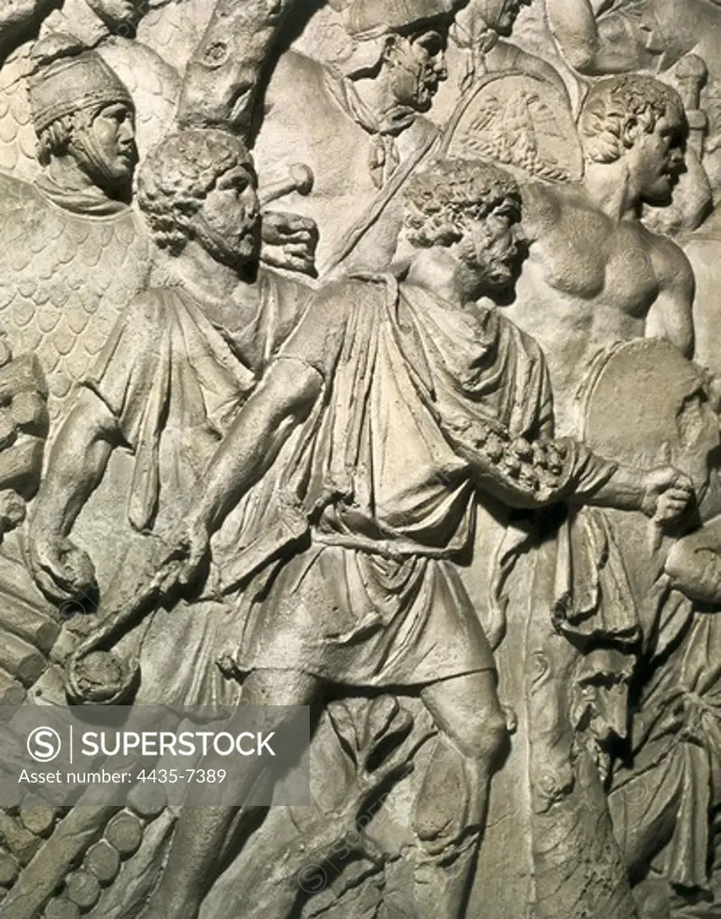 APOLLODORUS OF DAMASCUS (60-129). Column of Trajan. 110. ITALY. Rome. Forum of Trajan. First Dacian War. III Campaign. 'Funditores' (slingers) from the Balearic Islands. Auxiliaries of the Roman army. Roman art. Early Empire. Relief on marble.