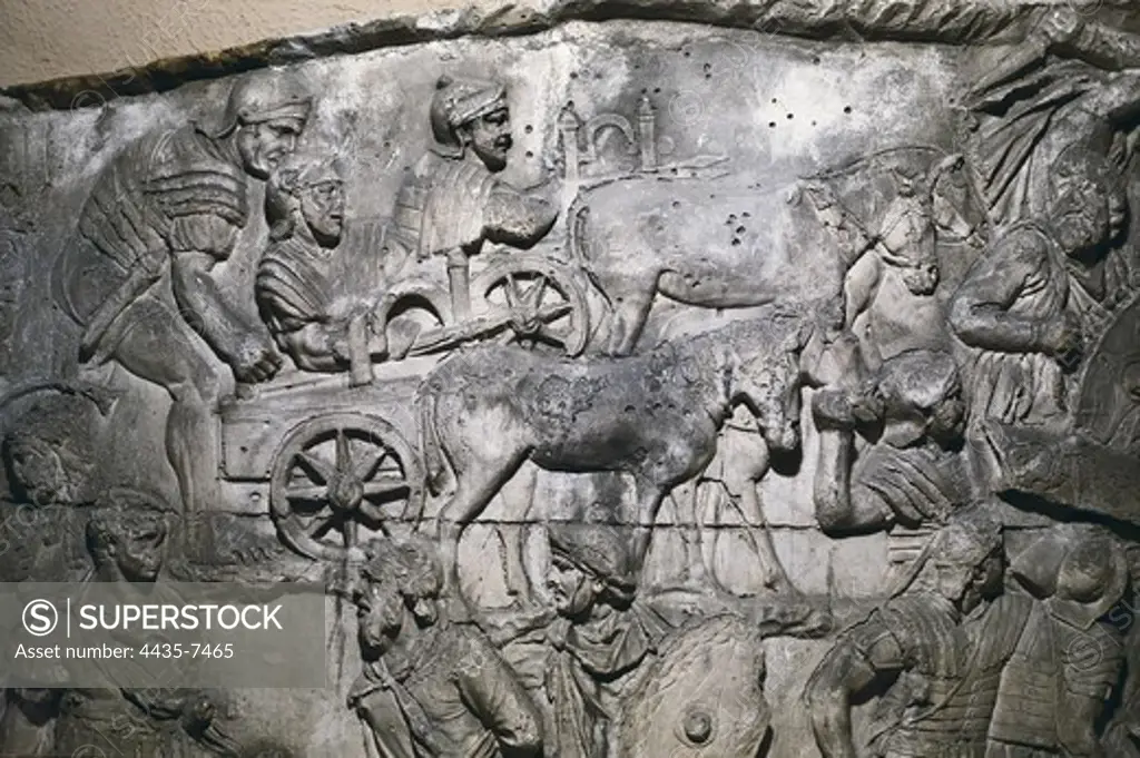 APOLLODORUS OF DAMASCUS (60-129). Column of Trajan. 110. ITALY. Rome. Forum of Trajan. First Dacian War. II Campaign. Carrobalistae. Siege machines consisting in ballistae mounted on carts of mules. Roman art. Early Empire. Relief on marble.