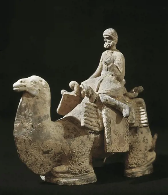 Man on camel. 4th c. - 6th c. Northern Wei Dynasty. Chinese art. Wei period. Terra-cotta. FRANCE. ëLE-DE-FRANCE. Paris. MusŽe Cernuschi (Cernuschi Museum).