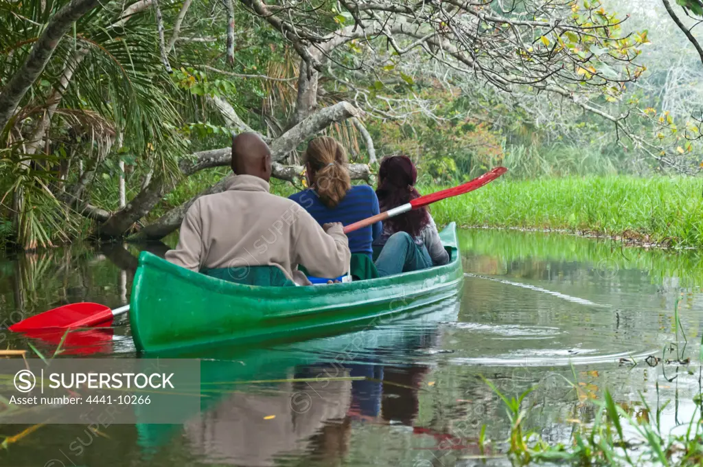 Tourists (guests) at Kosi Forest Lodge canoeing on the Sihadla Channel. Isimangaliso Wetland Park (Greater St Lucia Wetland Park). Manguzi (Kwangwanase). Maputaland. KwaZulu Natal. South Africa