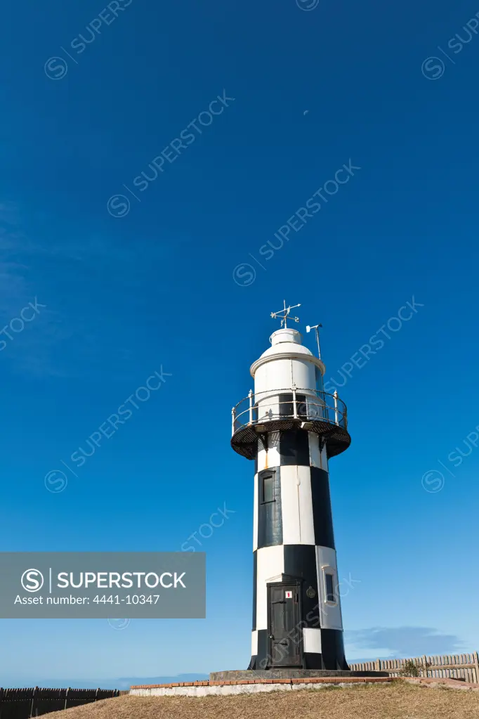 Port Shepstone Lighthouse. KwaZulu Natal South Coast.Natal South Africa. This 8 metre circular cast iron tower is painted with a black and white checkered design. The lighthouse is equipped with a radio beacon and is fully automatic.