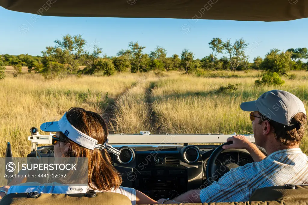 Couple on game drive. Timbavati Game Reserve. Limpopo Province. South Africa