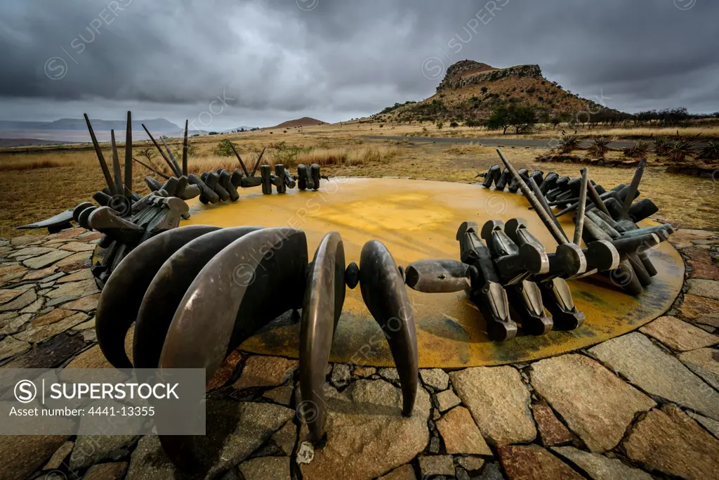 The Monument to the fallen Zulu Warriors at Isandlwana Battlefield. KwaZulu Natal Midlands. South Africa. A large bronze iziqu (bravery) necklace, symbolising courage and loyalty to the Zulu kings.