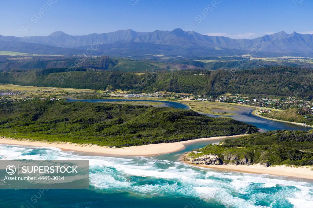 Sedgefield and Sedgefield Lagoon with Oteniqua Mountains in distance. Aerial view. Sedgefield. Garden Route. Western Cape, South Africa.