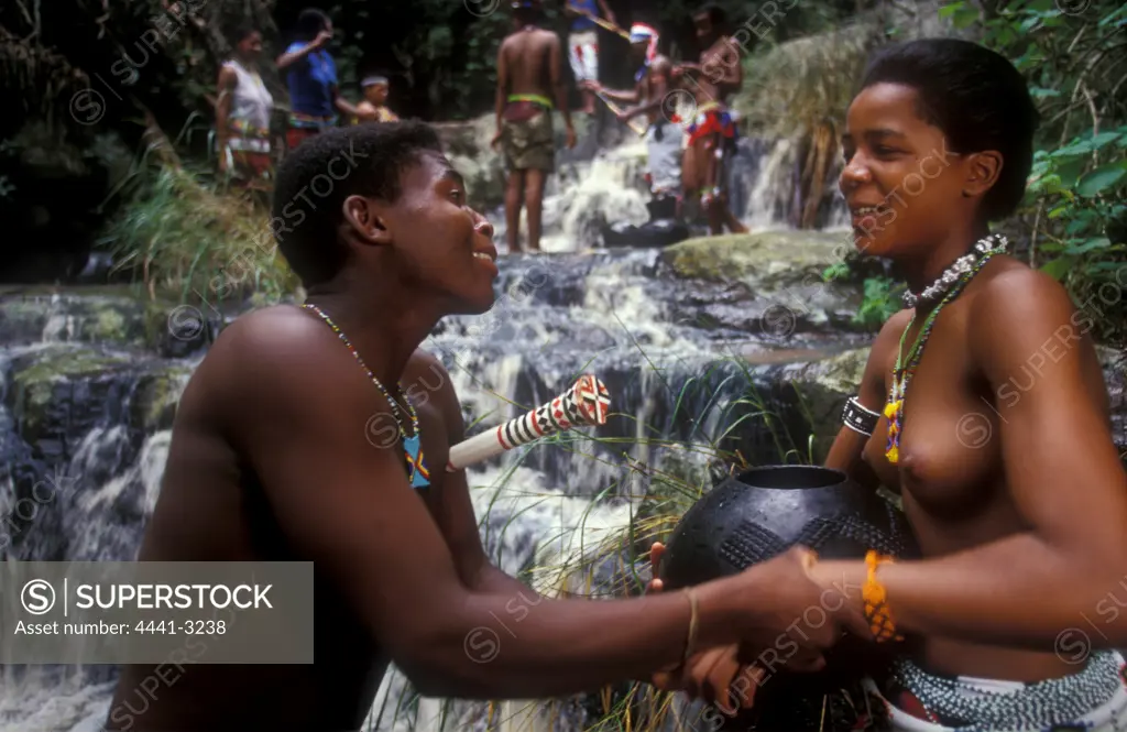 Zulu Man Courting a young woman at the river. Melmoth, KwaZulu-Natal. South Africa