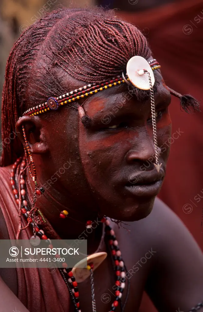 Detail of a Maasai warrior's elaborate coiffure aond beadwork.
