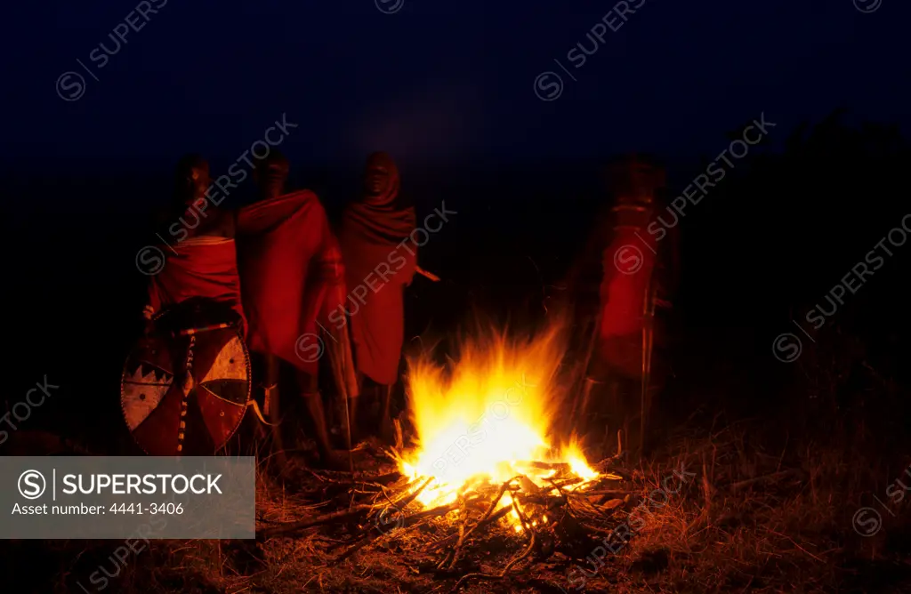 Maasai warriors at the fireside. Olonana village. Maasailand. kenya.