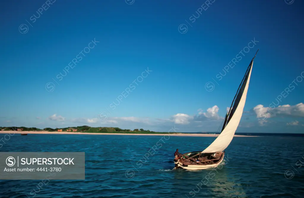 Dhow sailing past Margaruque Island near Vilanculos. Mozambique.