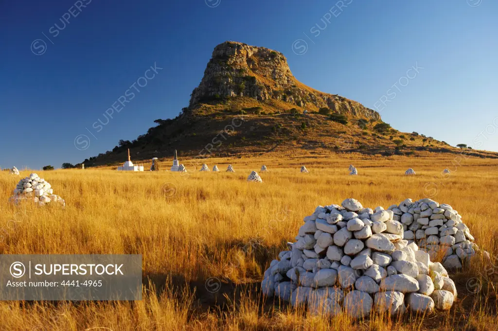 Cairns of white stones and memorials mark the places where British soldiers died at the Battle of Isandlwana during the Anglo Zulu War of 1879. Near Nqutu. kwaZulu-Natal. South Africa