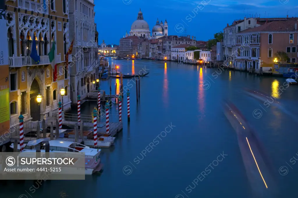 Canal Grande (Grand Canal) showing the domes of The Church of Santa Maria della Salute. Venice. Italy