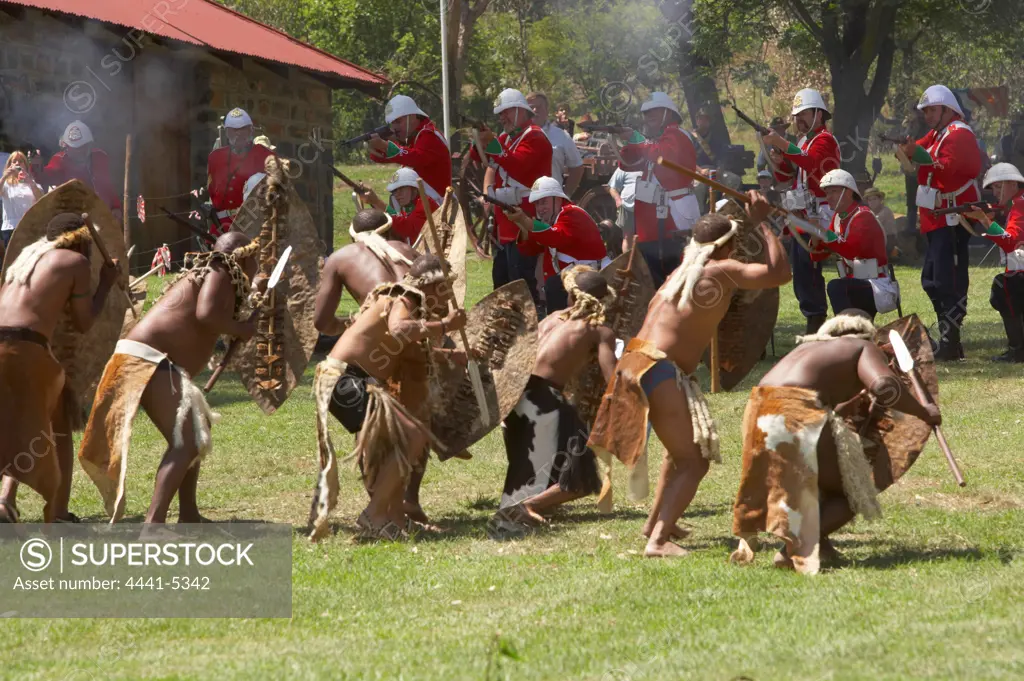 British soldiers fighting against Zule warriors at the reenactment of the Battle of Talana. Dundee. KwaZulu Natal. South Africa
