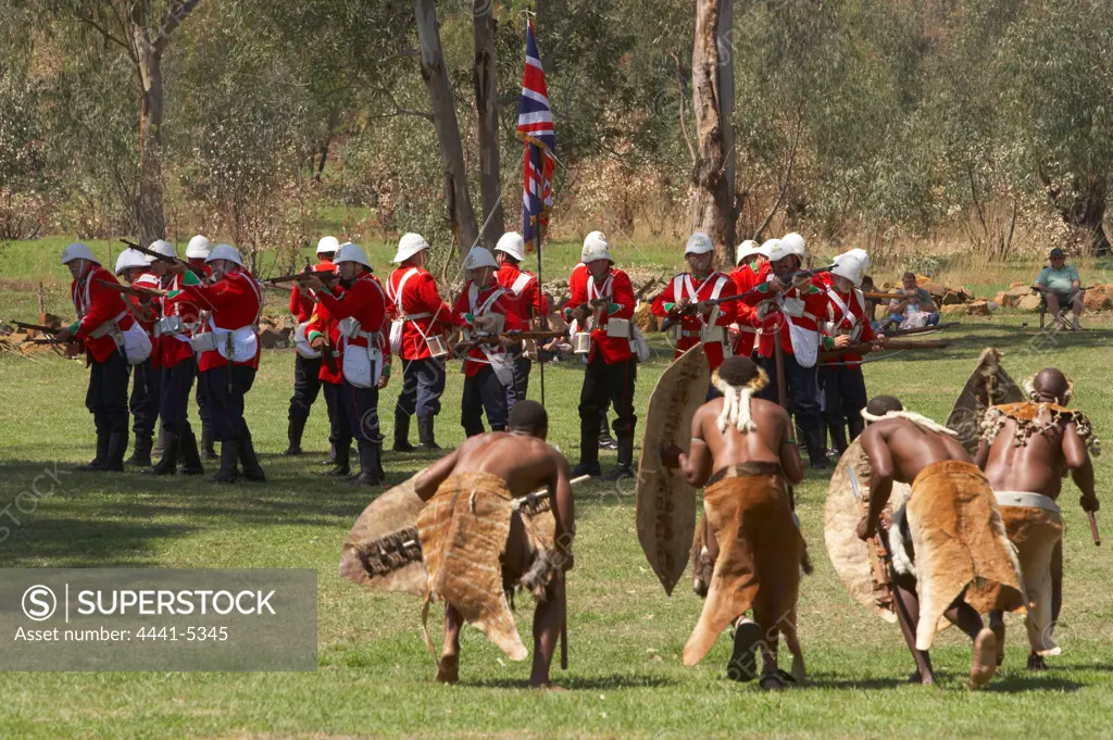 British soldiers fighting against Zule warriors at the reenactment of the Battle of Talana. Dundee. KwaZulu Natal. South Africa