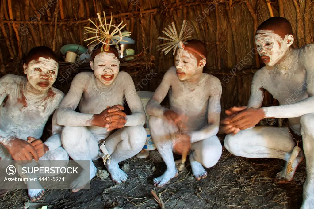 Xhosa amaKwetha (young men who have just been circumcised as part of their initiation into manhood) inside their hut. Coffee Bay. Wild Coast.  Eastern Cape. South Africa