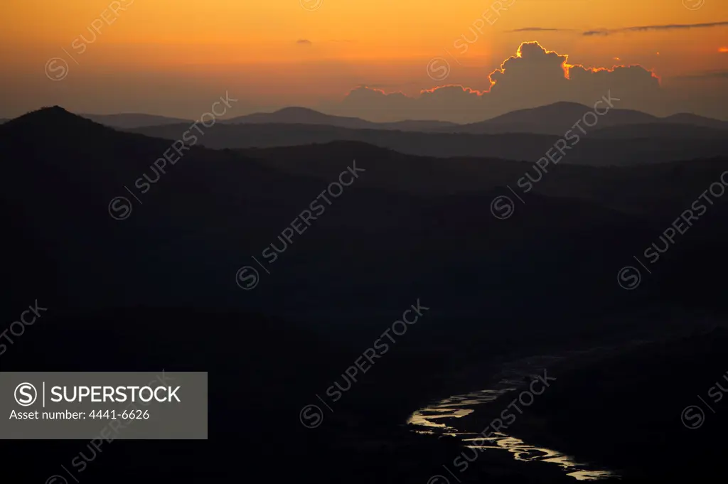 Sunrise from Mpila Hill with Black Umfolozi River in foreground. Hluhluwe Imfolozi Park. KwaZulu Natal. South Africa