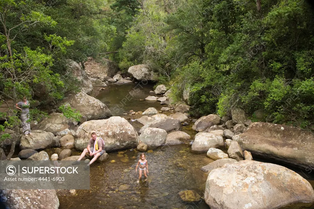 Family relaxing at the river. Cascades. Royal Natal National Park. KwaZulu Natal. South Africa.