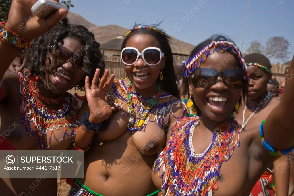 Zulu girls in traditional dress at the  Zulu Reed Dance. They celebrate having deliverd reeds to the King as symbol of their virginity. eNyokeni Royal Palace. Nongoma. KwaZulu Natal. South Africa