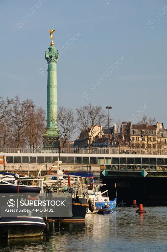 Bassin de l'Arsenal on the Siene River. The July Column (Colonne de Juillet) which commemorates the events of the July Revolution (1830) Paris is in the background. France