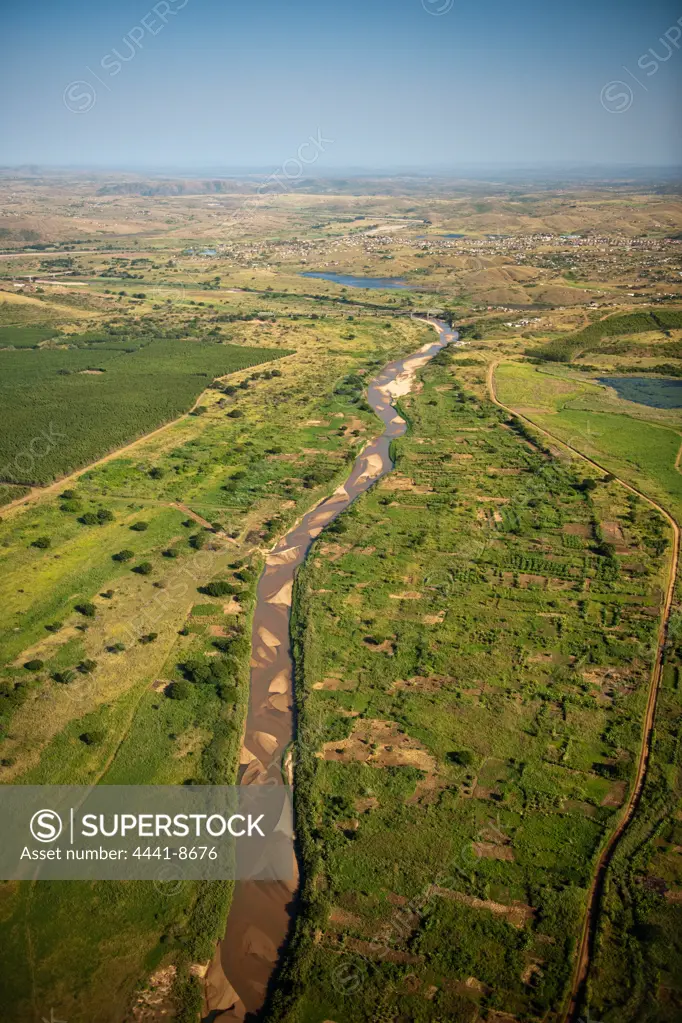 Aerial view of the Umfolozi River showing subsistance farming on its flood plains. KwaZulu Natal. South Africa