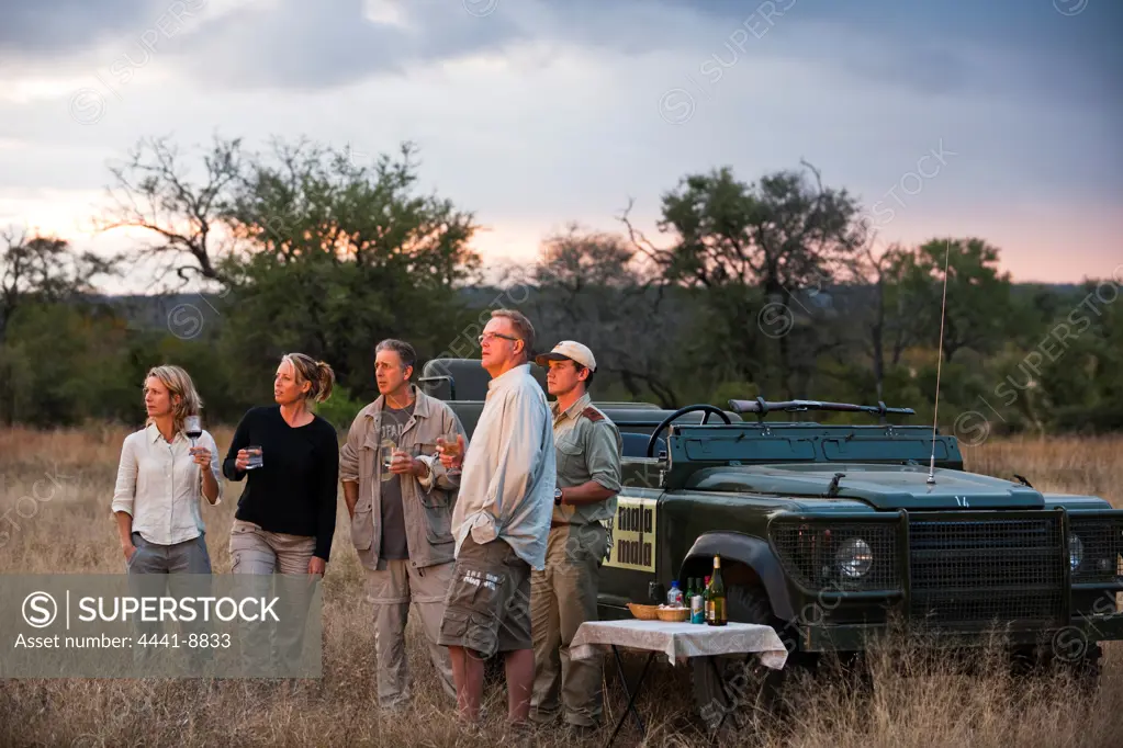 Guests on game drive having sundowners. MalaMala (Mala Mala) Game Reserve. Mpumalamga. South Africa