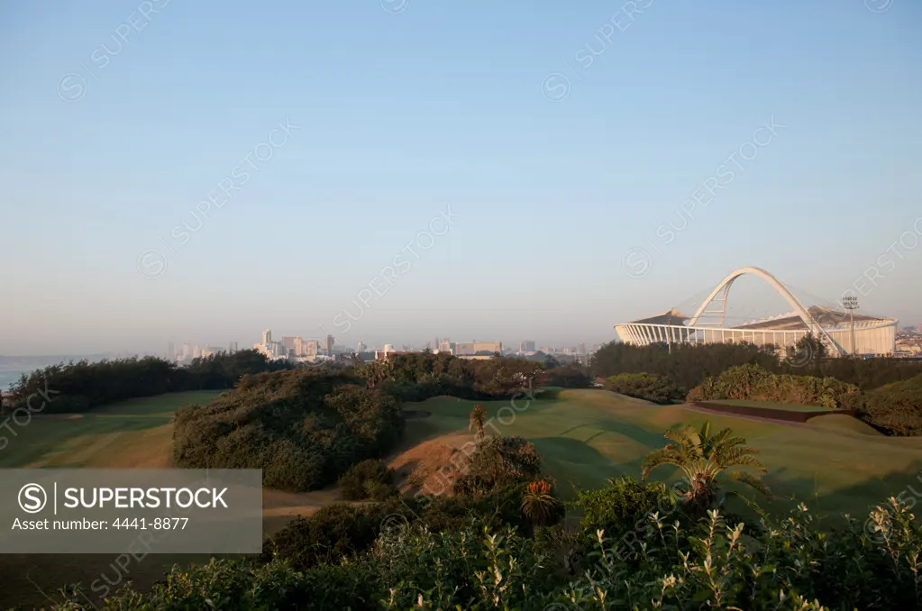 Moses Mabhida Soccer Stadium from the Durban Country Club golf course with the City Skyline in the background. Durban. KwaZulu Natal. South Africa.