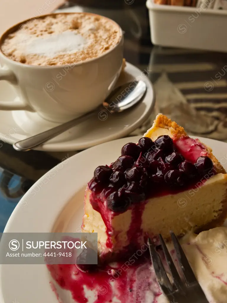 Cappuccino and bluberry cheesecake at Bluberry Hill Reataurant. Nottingham Road. KwaZulu Natal Midlands. South Africa