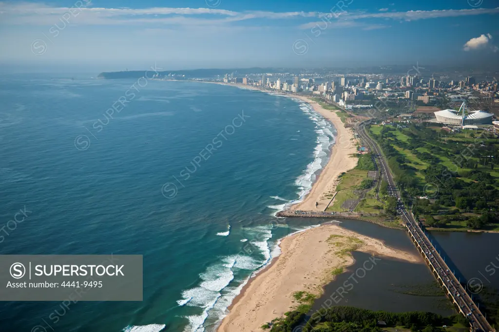 Aerial view of Durban from above Umgeni River Mouth showing The Moses Mabhida Stadium and city in the background. KwaZulu Natal. South Africa.
