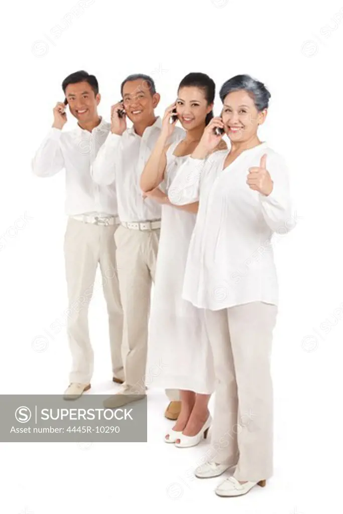 Young couple and senior couple making phone call