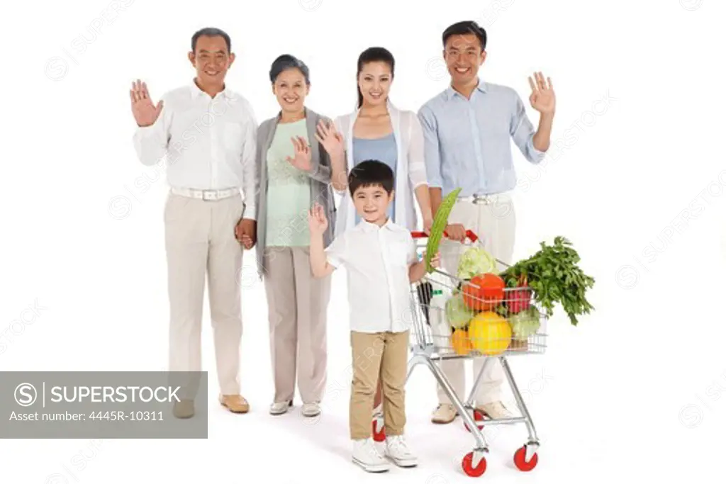 Whole family shopping with shopping cart