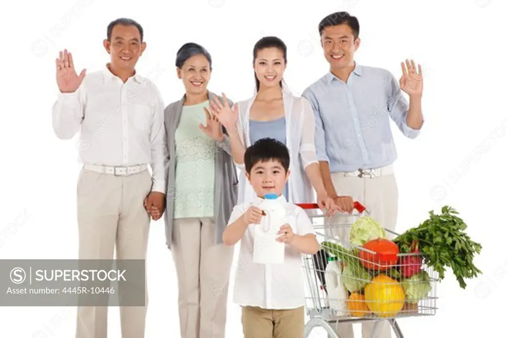 Whole family shopping with shopping cart