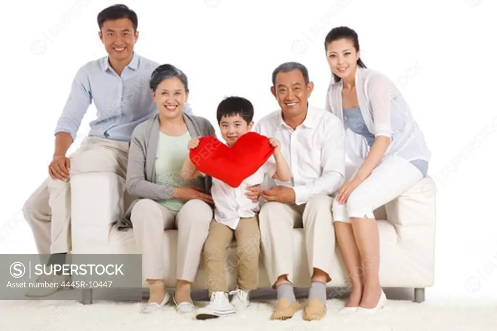 Whole family sitting in sofa