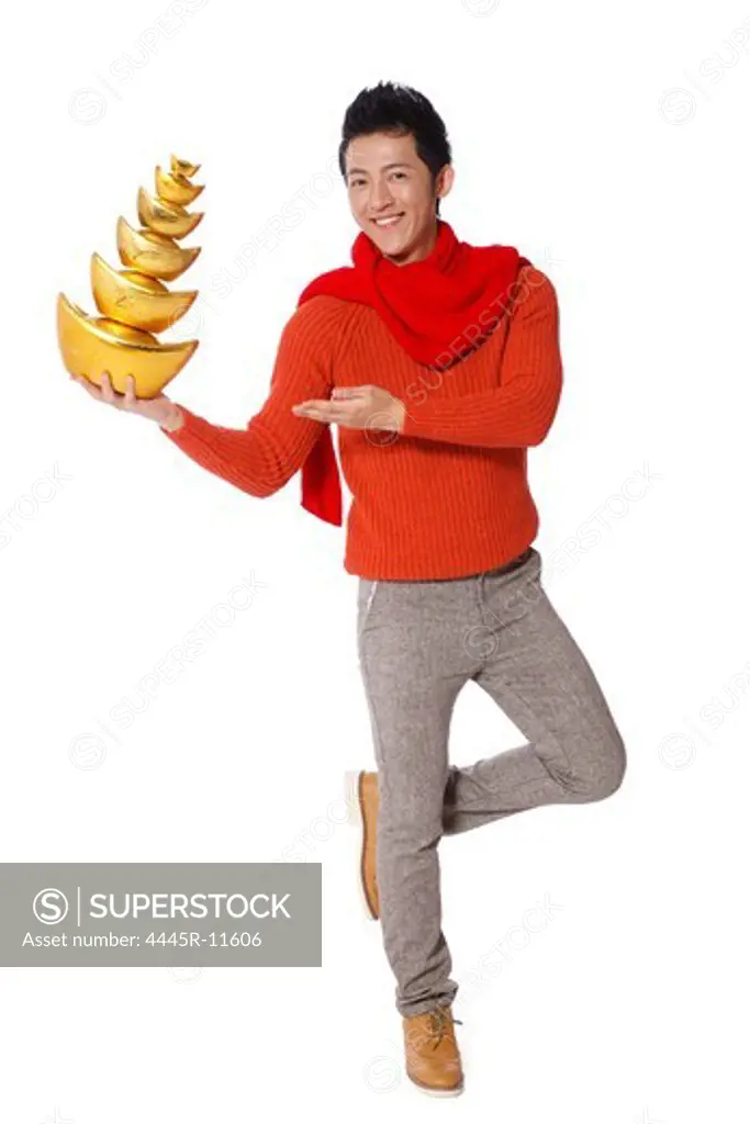 Young man with gold ingots