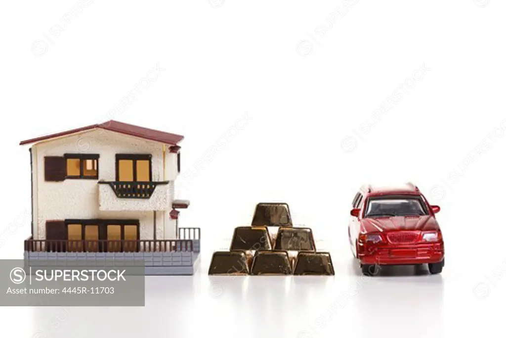 Architectural model,car model and gold bars