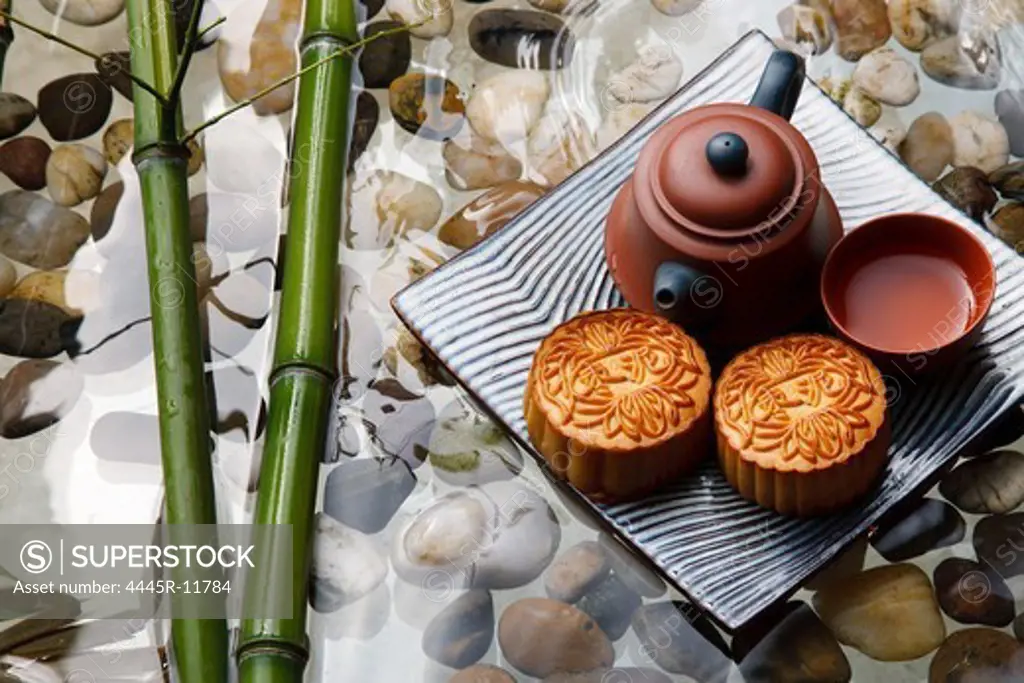 Close-up of moon cakes and teapot