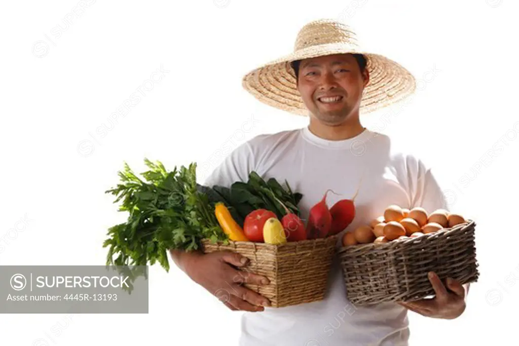 Farmer holding basket of vegetables