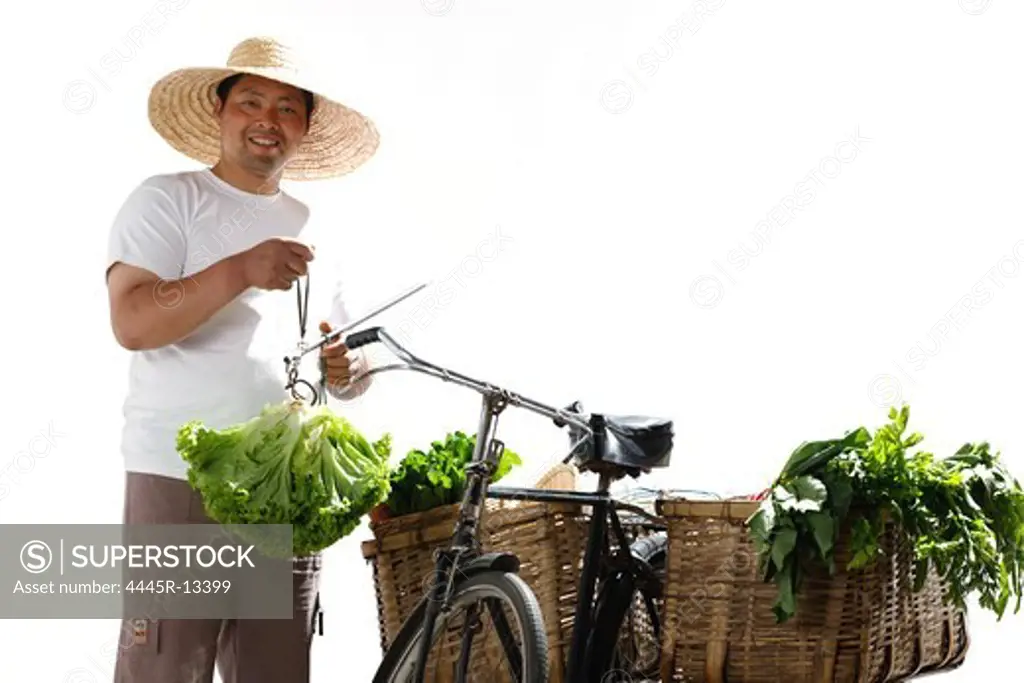 Farmer weighting vegetables