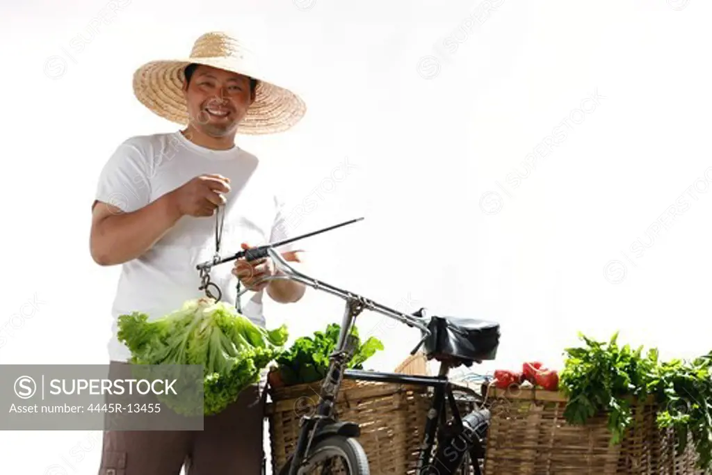 Farmer weighting vegetables