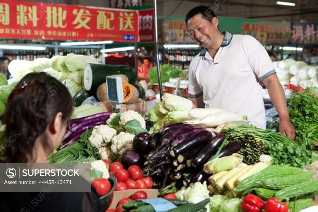 Farmer selling vegetables in food market
