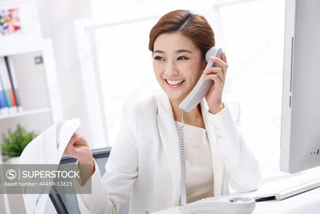 Young business lady making phone call