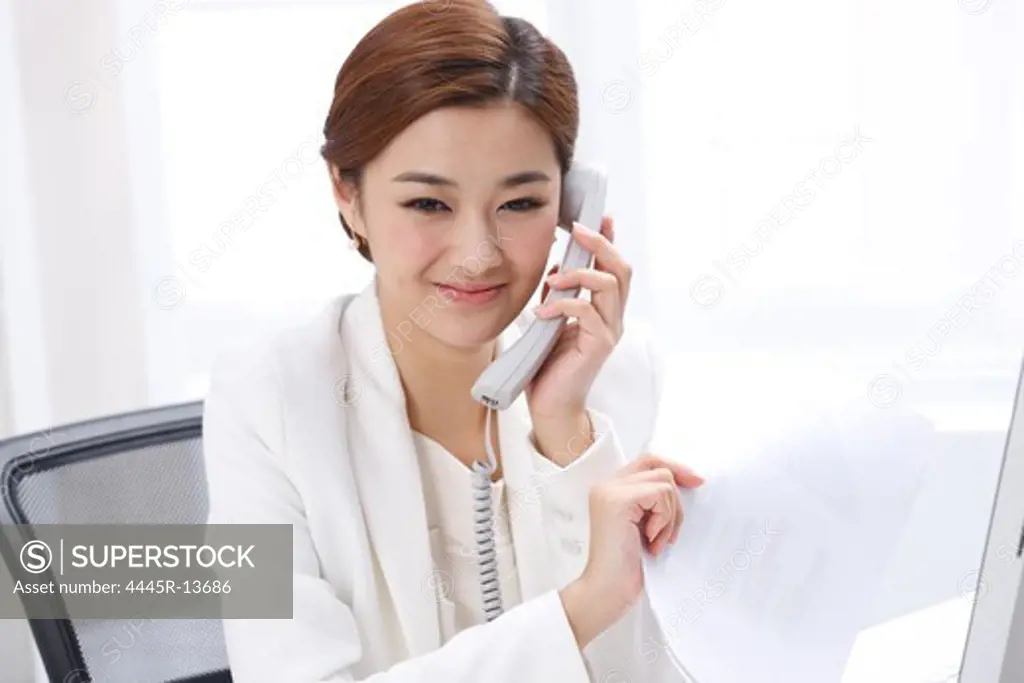 Young business lady making phone call