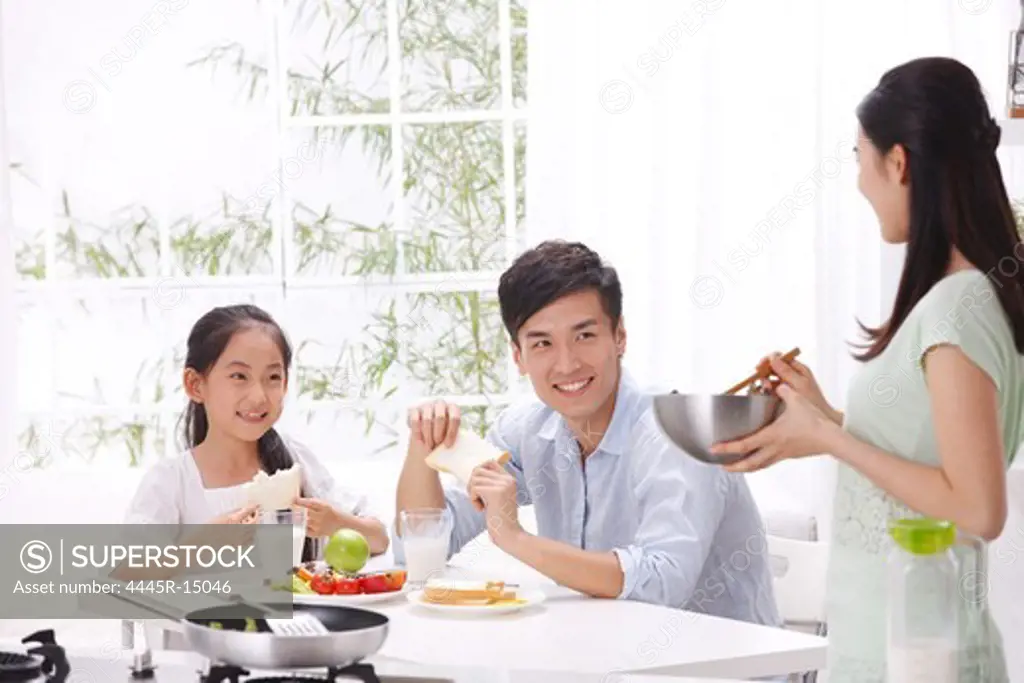 Family eating in kitchen