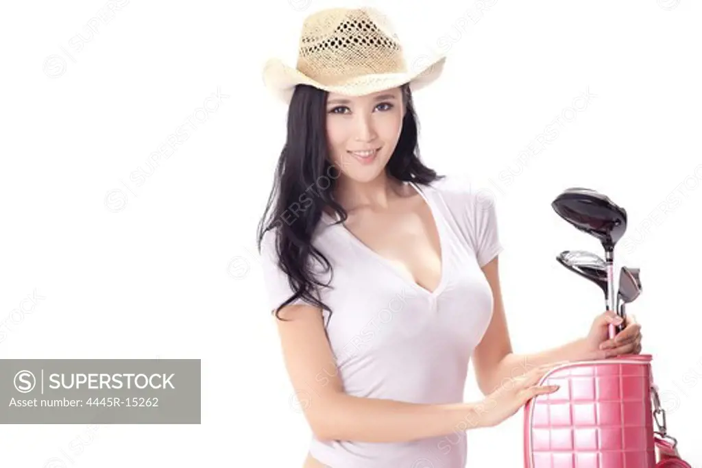 Sexy woman carrying golf bag