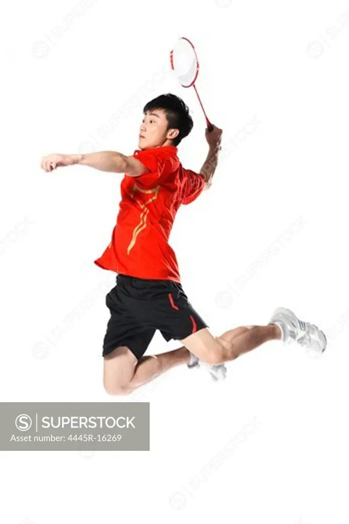 Male athletes playing badminton