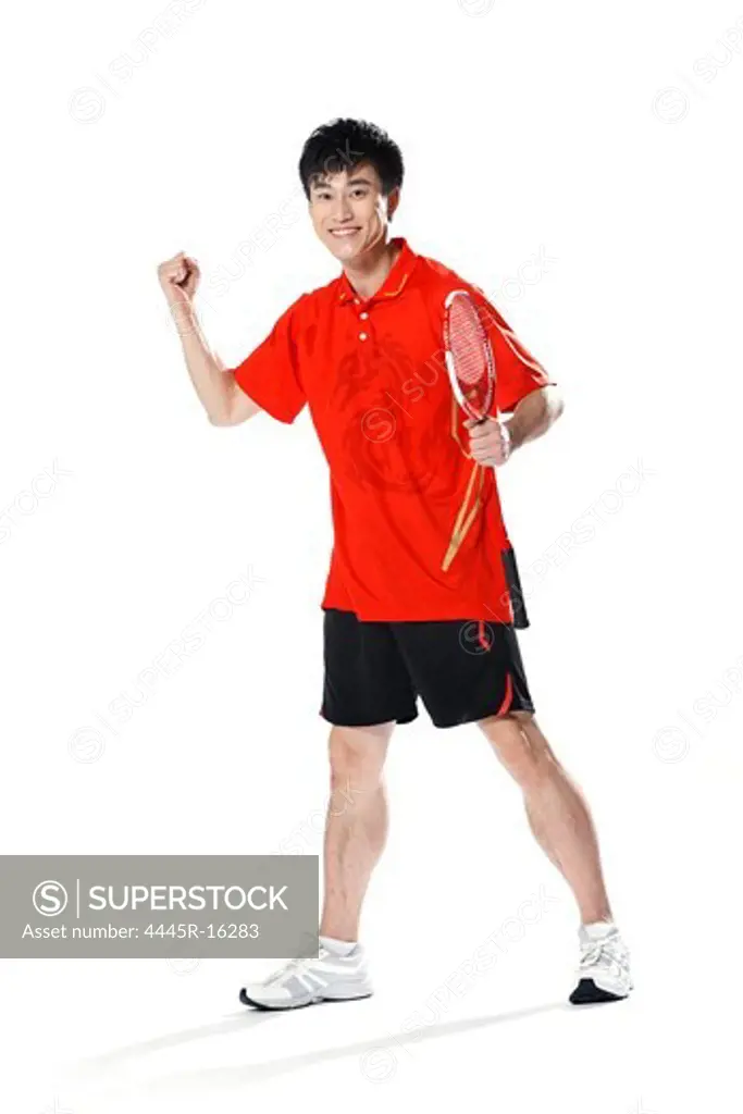 Male athletes playing badminton