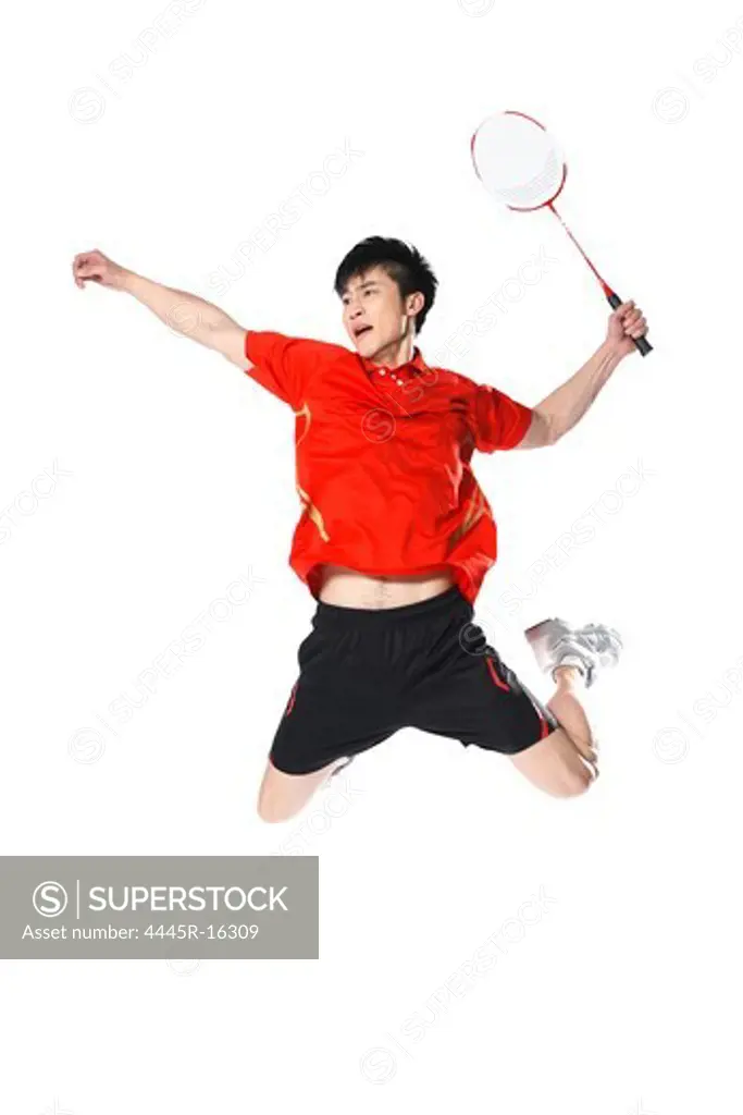 Male athletes playing badminton