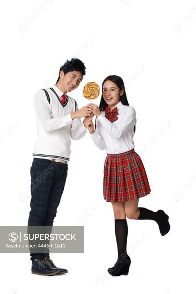 Student Young man and young woman with lollipop