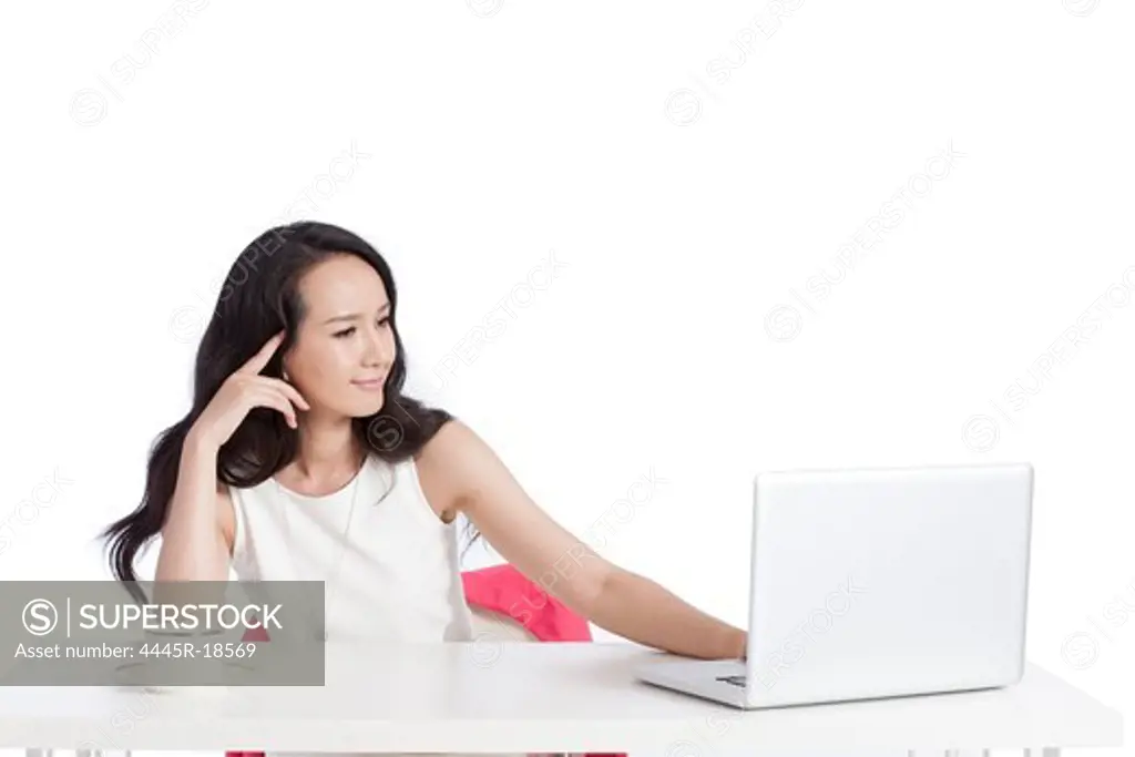 Young female white-collar workers using a laptop