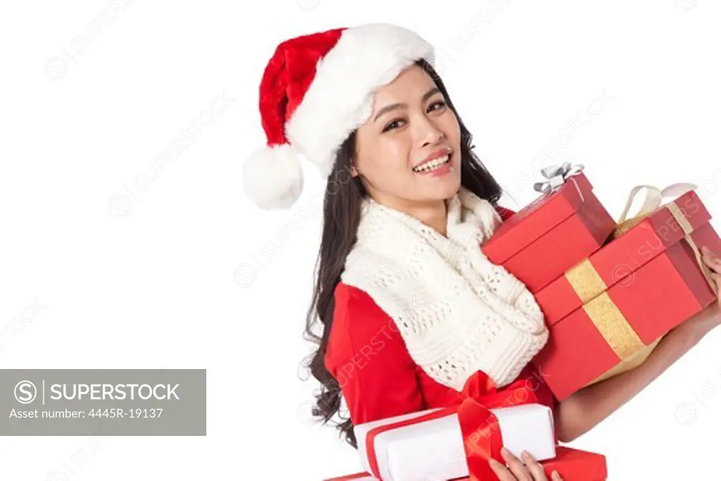Young woman holding Christmas presents