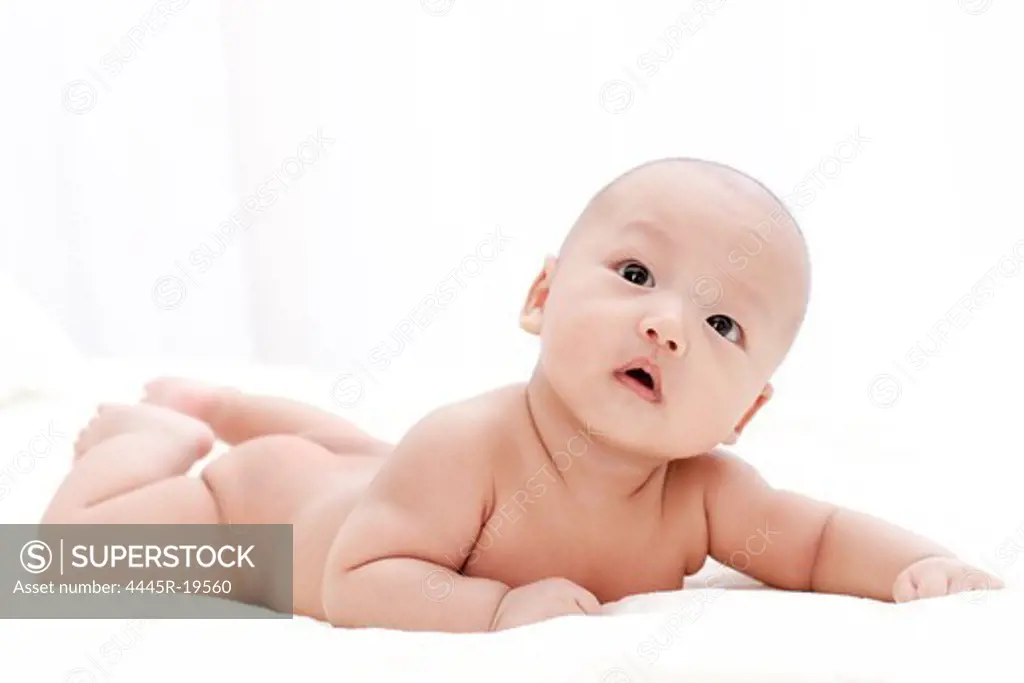 Cute baby lying on the bed